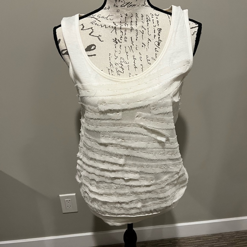 Beautiful under a jacket with delicate details.  From non smoker